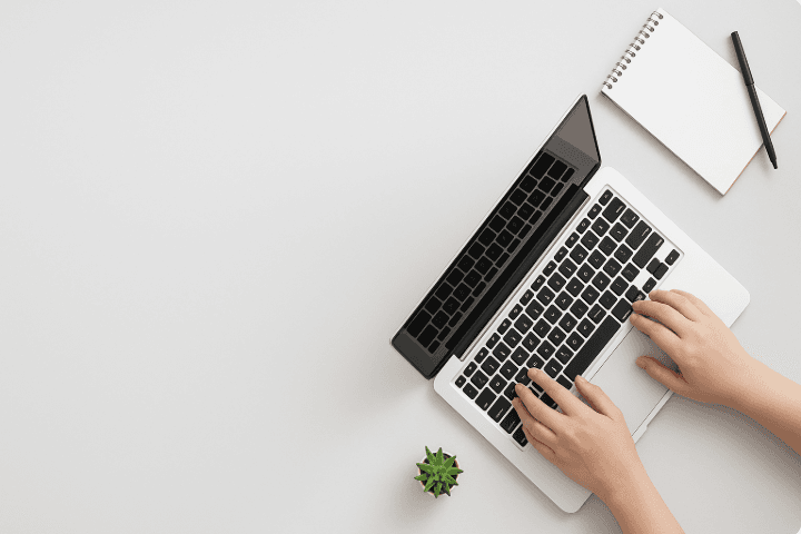 Hand typing on keyboard